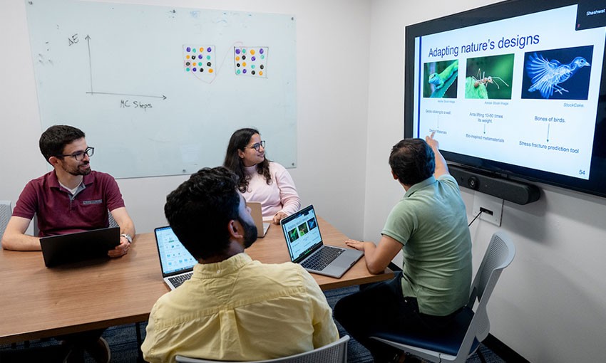 engineering-professor-students-table Professors and students viewing images on screen